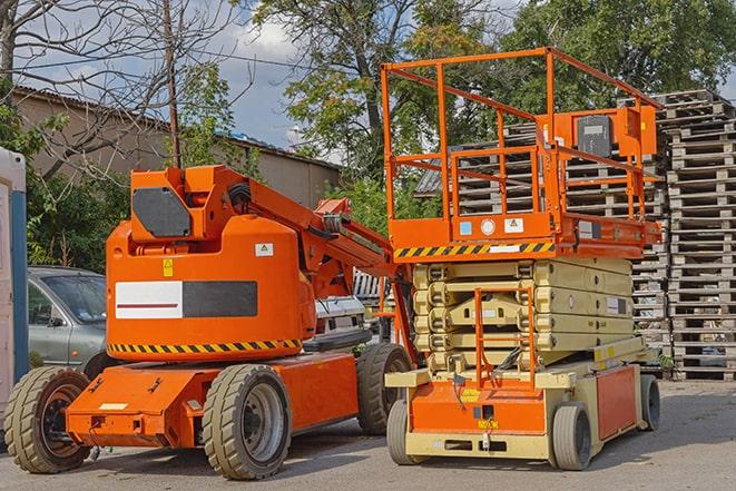 forklift transporting goods in a busy warehouse setting in Elk Grove